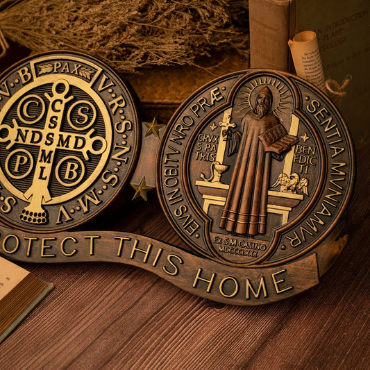 St. Benedict medal wall carving showing both faces of the medal above a Protect This Home banner