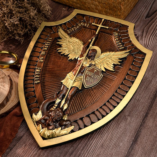 The Michael Shield on a table with pinecones and winter greens