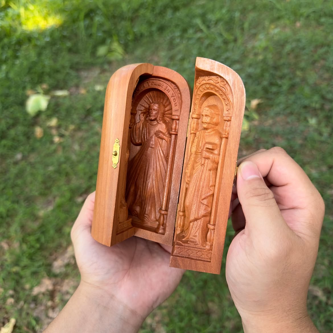 Two travel altars held side by side, doors open