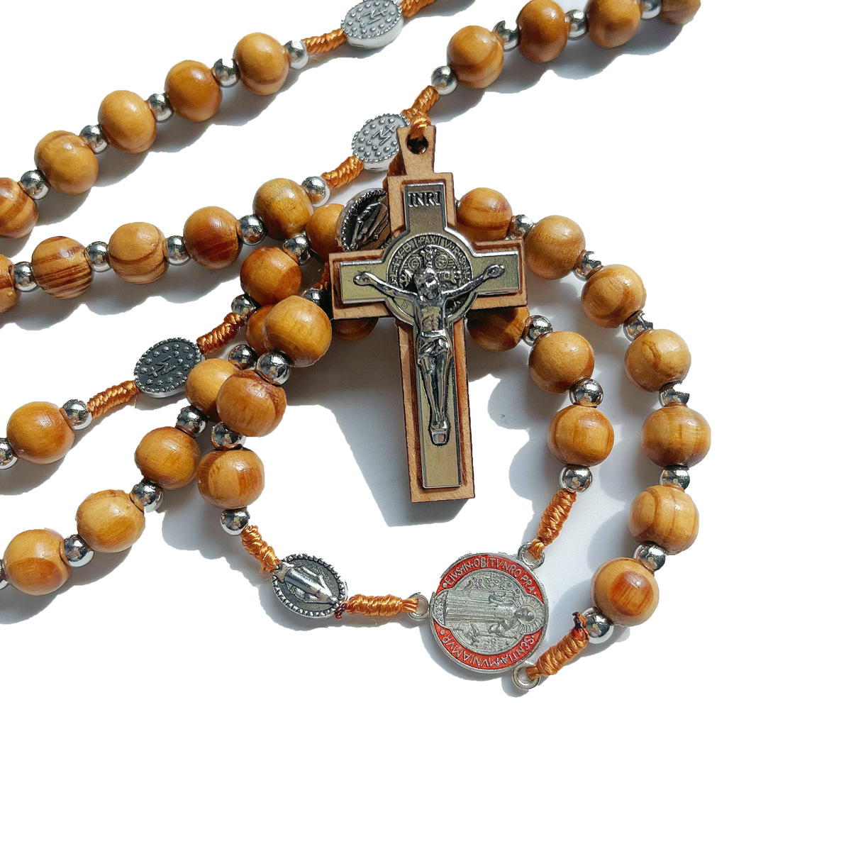 Close view of the St. Benedict medal on the rosary