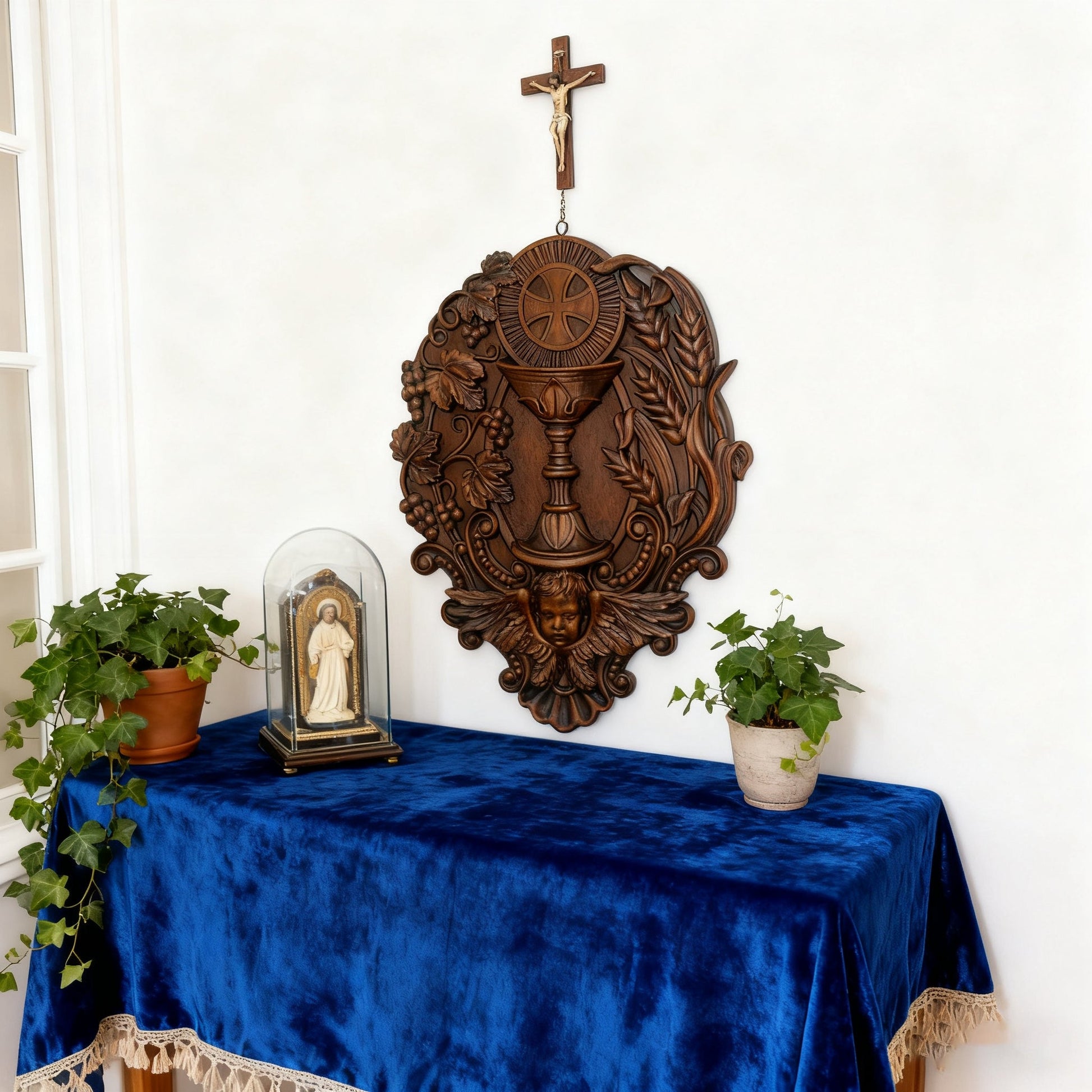 The First Communion carving on a blue altar cloth