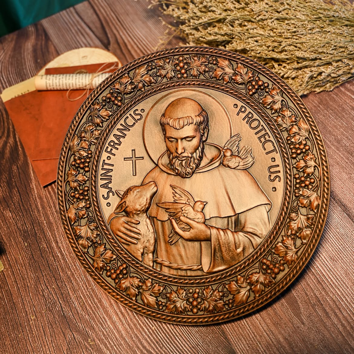 St. Francis of Assisi carved wood medallion with lamb and doves inside a vine border